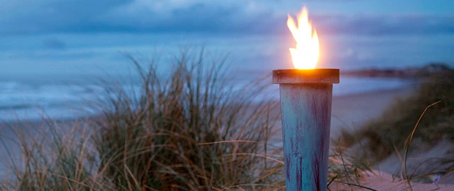 Fakkel på en strand
